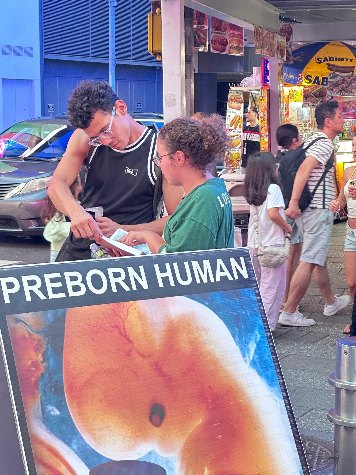 Sidewalk outreach with a preborn human display